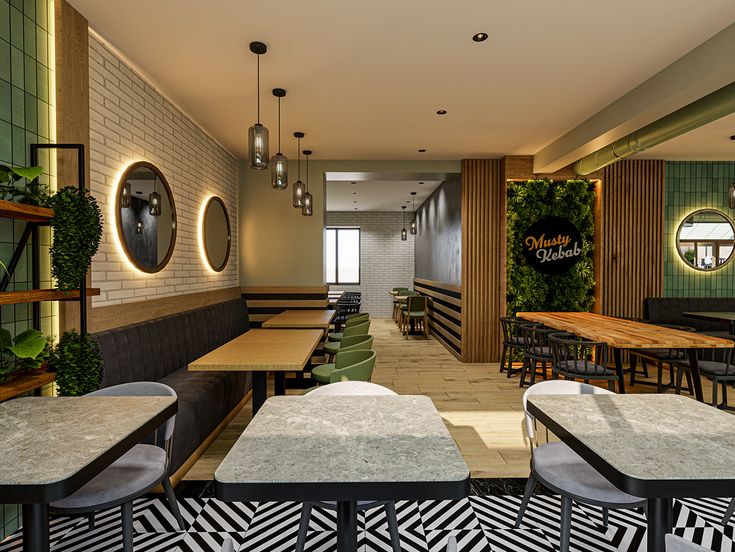 Salle du restaurant avec tables en bois, banquettes et plantes vertes